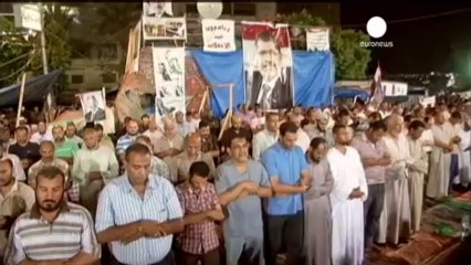 Pro-Mursi supporters wait on police to end their protests