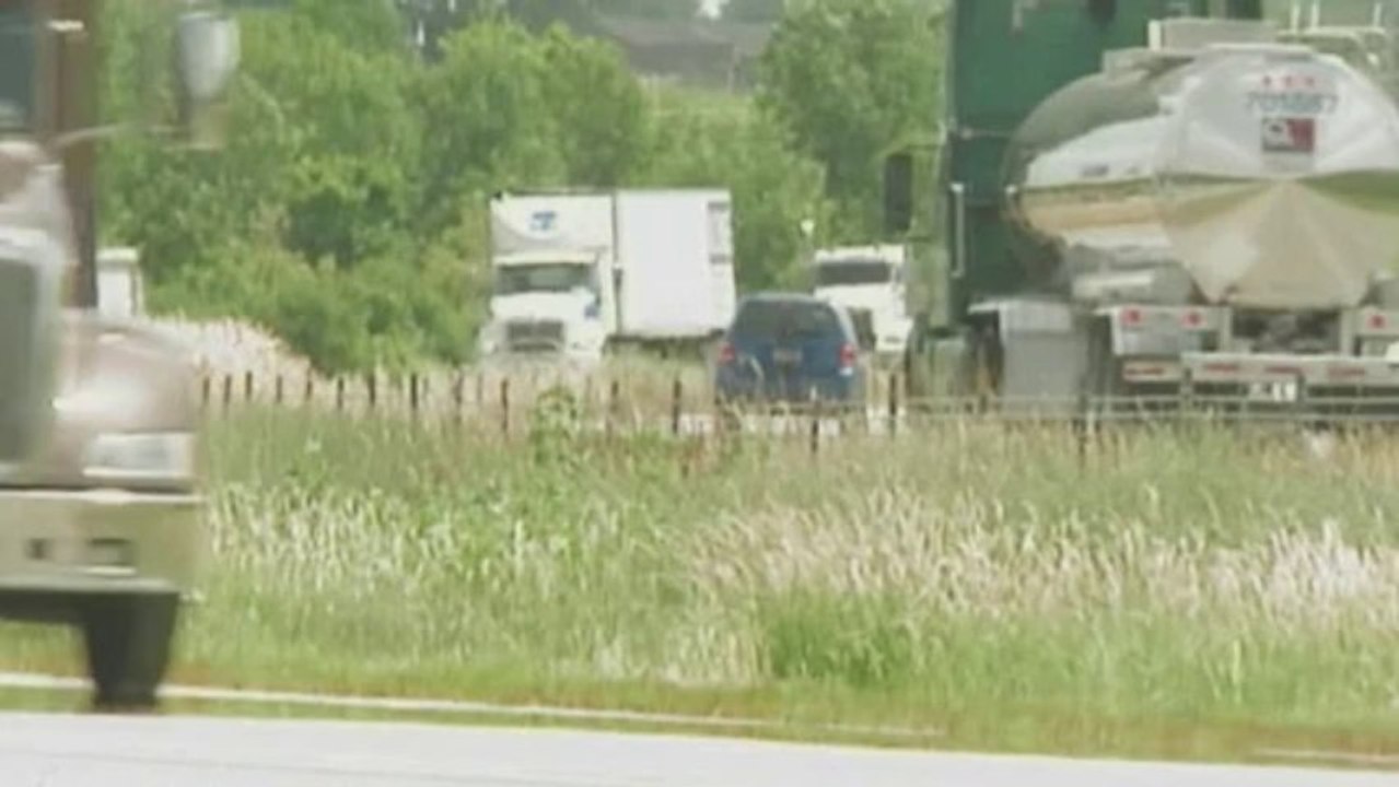 Lorry slams police car at roadside
