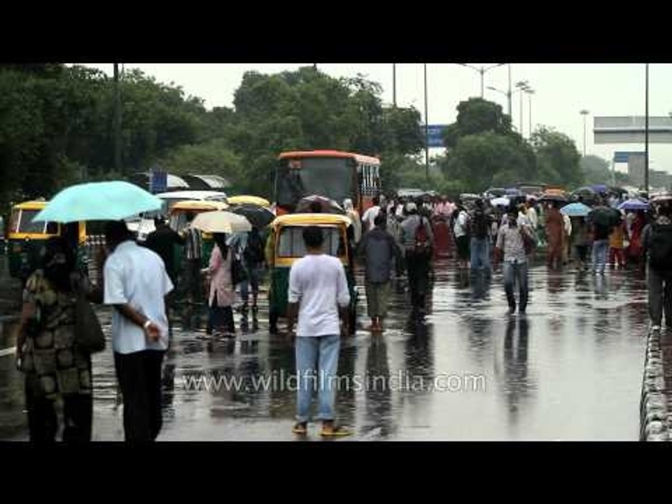 Monsoon cools down Delhi: Umbrellas gather at Safdarjung bus stop