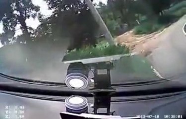 A girl is trying to learn how to drive.... The car finishes on the roof!