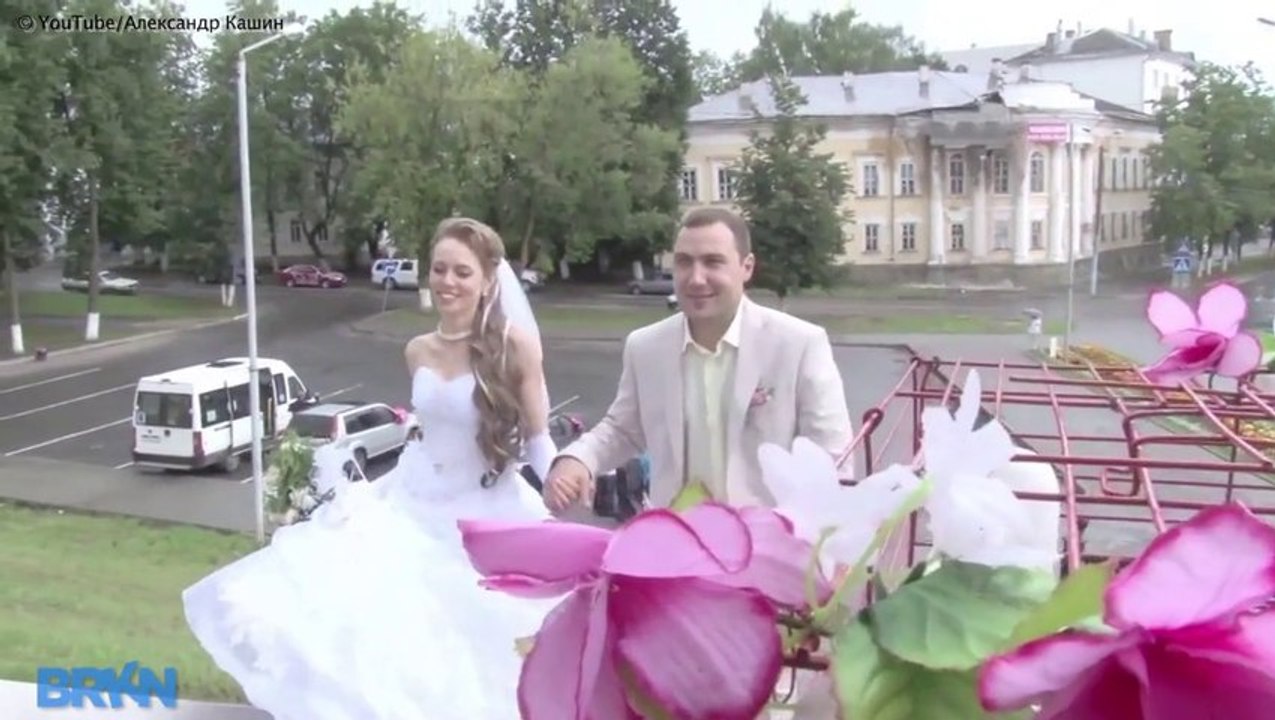 Building Collapses Behind Wedding Couple