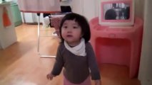 Cute Korean girl runs from her daddy