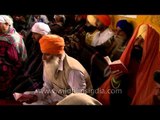Pilgrims performing 'Paath' rituals at Hemkund Sahib Gurudwara