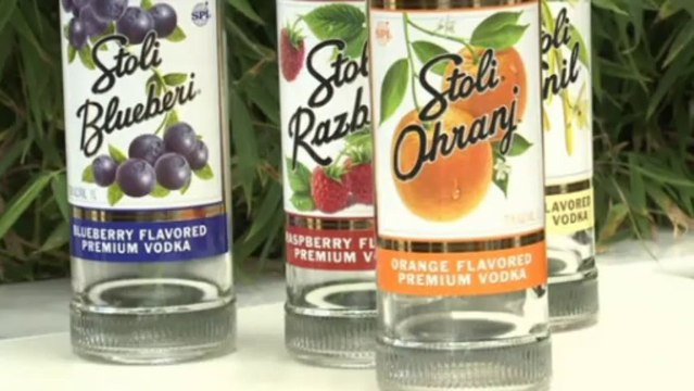 Gay rights activists pour Russian vodka into the streets