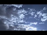 Clouds moving in fast motion over the American cities - Time Lapse