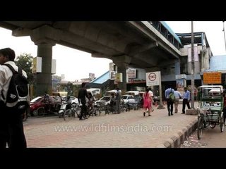 Crippled - handicapped man managing to walk admirably in Delhi