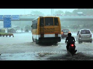 Heavy rains flood roads and halt traffic in Delhi