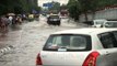 Cars plying on flooded road at Safdarjung