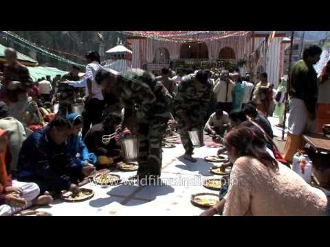 Army men serving food to devotees of Gangotri temple