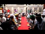 Food being distributed to Muslim devotees during Iftar at Nizamuddin Dargah