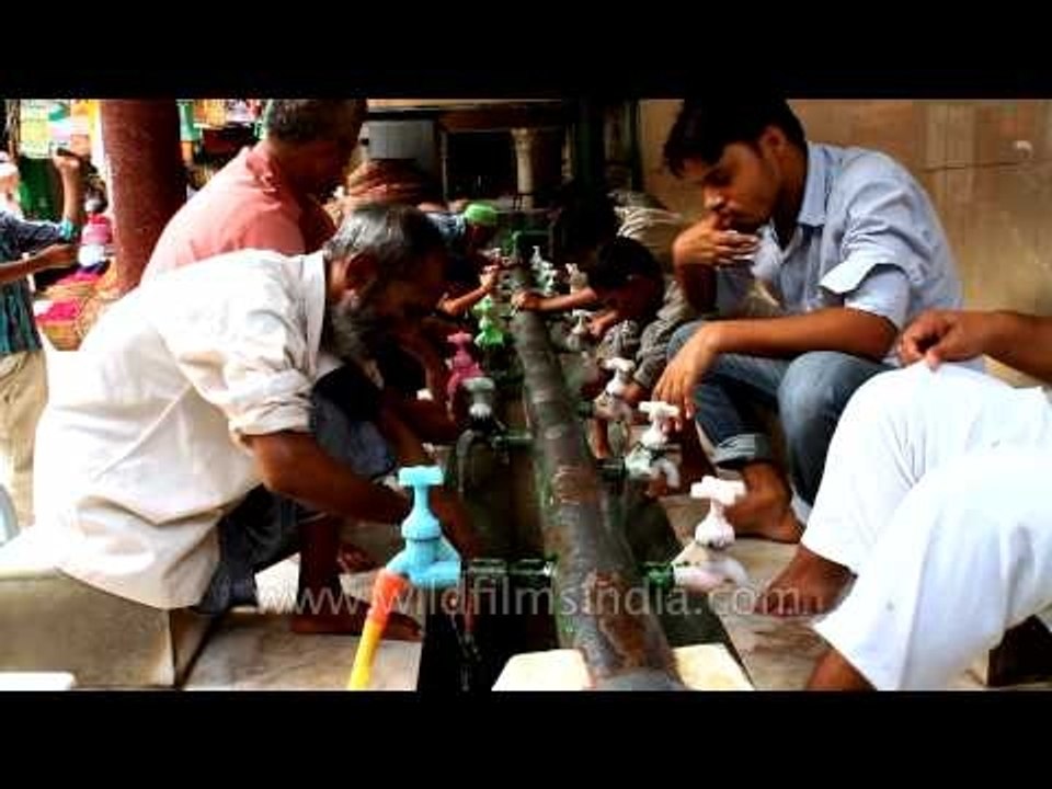 People performing wudu before Iftar at Nizamuddin Dargah in Delhi