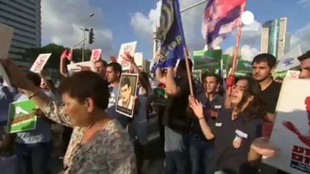 Palestinians prepare to welcome freed prisoners while...