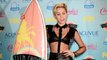 Miley Cyrus in a tight skin baring black outfit at the 2013 Teen Choice Awards