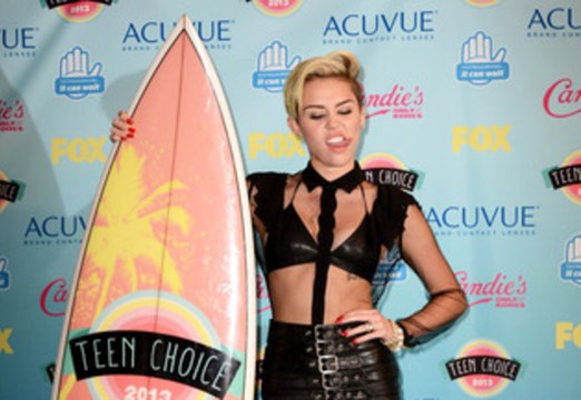 Miley Cyrus in a tight skin baring black outfit at the 2013 Teen Choice Awards