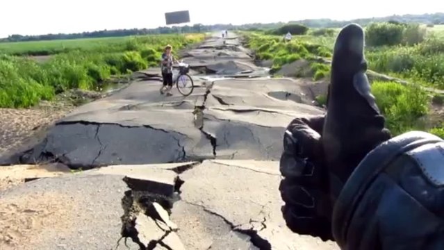 Russian massive floods destroy the road!! Asphalt deformed by water..
