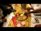 Muslim devotees eating food during Iftar at Hazrat Nizamuddin Dargah, Delhi