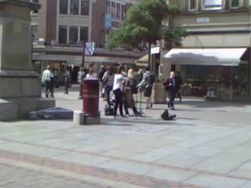 street musician at saint annes square manchester uk