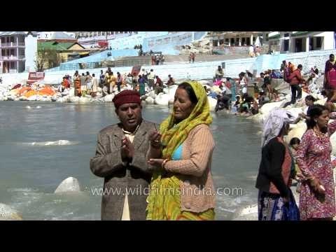 Couple prays at the banks of River Ganges at Gangotri Dham