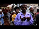 Muslims offering prayer before Iftar at Nizamuddin dargah