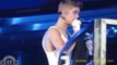 Justin Bieber Debuts his arm tattoo in concert