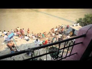 Devotees taking holy dip in River Ganga in quick motion, Rishikesh
