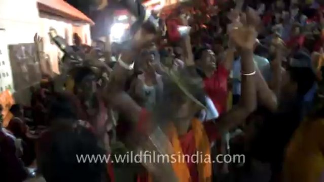 2298.Devotees singing and dancing at Kamakhya temple of Assam