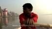 2560.Boating on the river Ganges beside Varanasi ghats