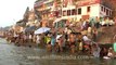 2561.Devotees taking holy dip in river Ganga in Varanasi