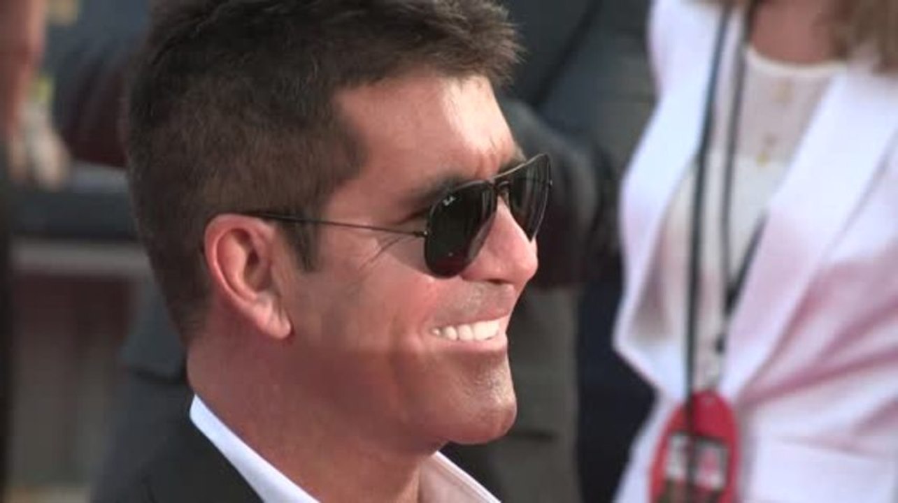 Simon cowell freut sich auf baby