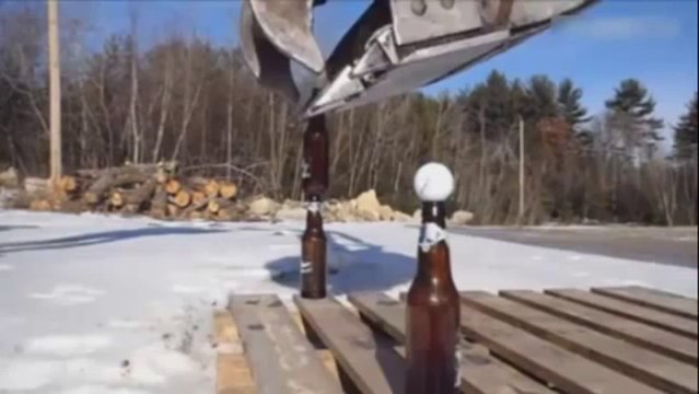 Stacked bottles of beer with an excavator!