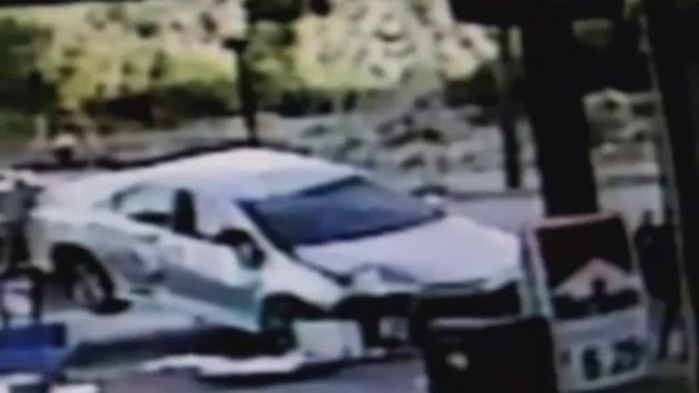 Car flip-rolls into petrol station