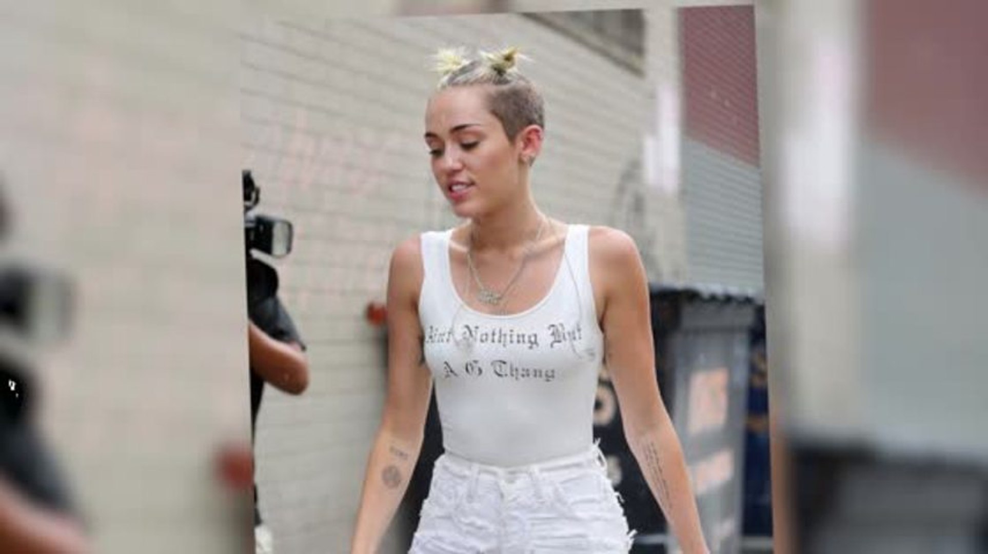 Miley Cyrus Looks All White as She Rocks Pig Tails in the Rain