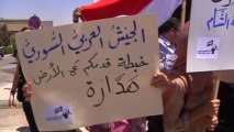 Protesters against U.S. military intervention cry 