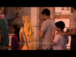 Believers looking at the camera at Birla Mandir