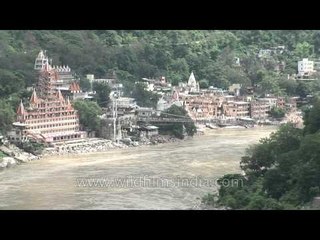 Large ashrams and fast flowing Ganga, Rishikesh, Uttarakhand