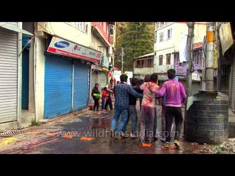 Smearing each other with paint and throwing coloured water, all done in a spirit of Holi celebration