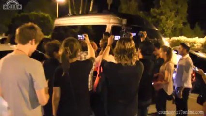 Justin Bieber dancing for his fans in a van