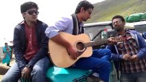 Playing guitar at babusar top(kaghaan valley) and having fun with friends