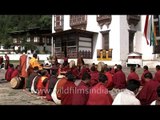 Monks performing rituals accompained by traditional music in Bumthang, Bhutan