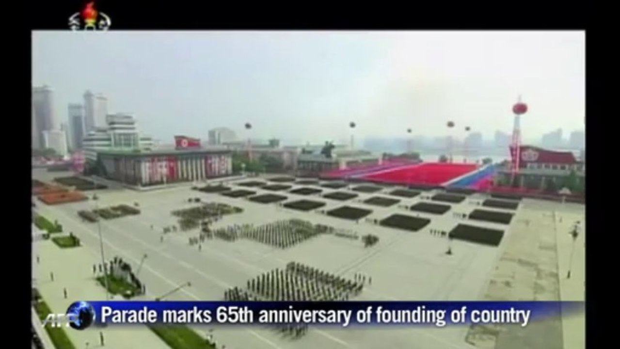 N. Korea leader presides over mass military parade