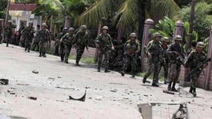 Fighting rages amid Philippine hostage crisis