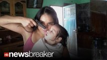 TERRIFYING: Photo of Woman Holding Gun at Baby’s Head Goes Viral