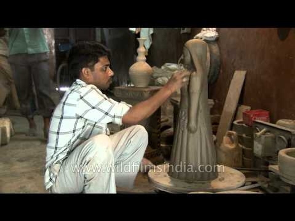Potter designing a sculpture
