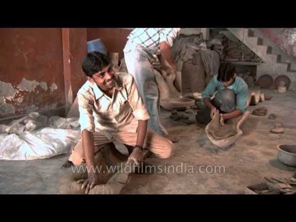Potters having fun while they were working
