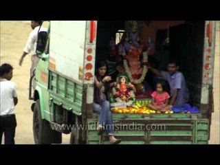 Home idols being taken to the sea for immersion