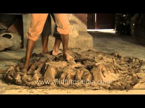 Potters pressing the clay