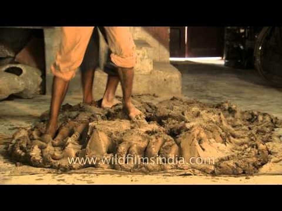 Potters pressing the clay