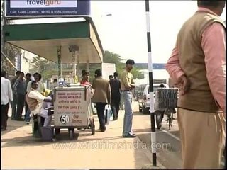 A handicapped beggar at the bus shelter, Delhi