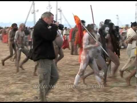 Naga sadhus running for the holy bath at Sangam during Ardh Kumbh, 2007