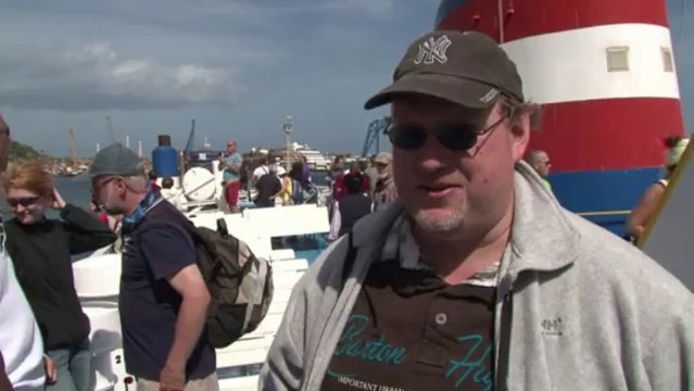 Tourists visit Costa Concordia salvage site